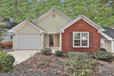 THIS STUNNING OPEN RANCH PLAN IS CONVENIENTLY LOCATED IN NORTH on Canongate At Flat Creek Club in Georgia - for sale on GolfHomes.com, golf home, golf lot