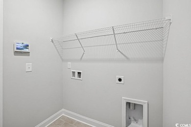 Welcome to the Mae Farmhouse -- a 4-bedroom, 3.5-bath home with on Tidewater Golf Club and Plantation in South Carolina - for sale on GolfHomes.com, golf home, golf lot