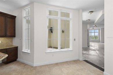 Discover luxury living in this exquisite two-story condominium on Winter Park Country Club in Florida - for sale on GolfHomes.com, golf home, golf lot