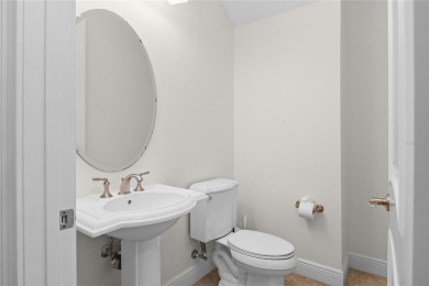 Discover luxury living in this exquisite two-story condominium on Winter Park Country Club in Florida - for sale on GolfHomes.com, golf home, golf lot