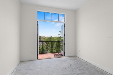 Discover luxury living in this exquisite two-story condominium on Winter Park Country Club in Florida - for sale on GolfHomes.com, golf home, golf lot
