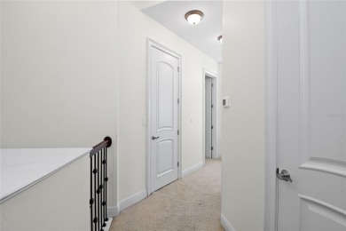 Discover luxury living in this exquisite two-story condominium on Winter Park Country Club in Florida - for sale on GolfHomes.com, golf home, golf lot