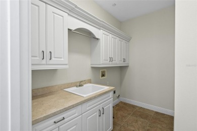 Discover luxury living in this exquisite two-story condominium on Winter Park Country Club in Florida - for sale on GolfHomes.com, golf home, golf lot