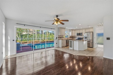 Welcome to this stunning pool home in the guard-gated Hunter's on Hunters Green Country Club in Florida - for sale on GolfHomes.com, golf home, golf lot