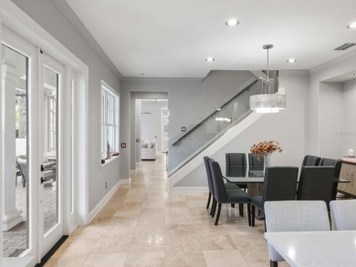 This private, tucked-away residence is perfectly located on the on Lake Nona Golf Club, Inc. in Florida - for sale on GolfHomes.com, golf home, golf lot