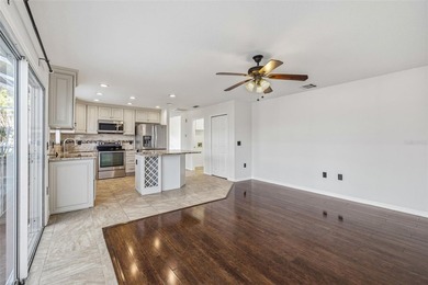 Welcome to this stunning pool home in the guard-gated Hunter's on Hunters Green Country Club in Florida - for sale on GolfHomes.com, golf home, golf lot