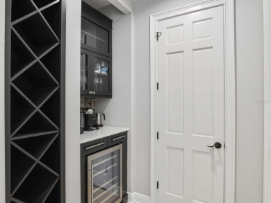 This private, tucked-away residence is perfectly located on the on Lake Nona Golf Club, Inc. in Florida - for sale on GolfHomes.com, golf home, golf lot