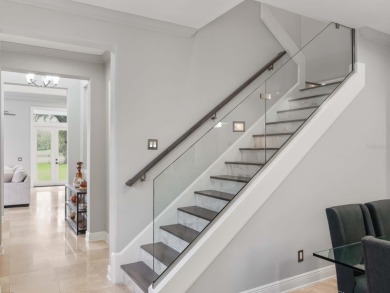 This private, tucked-away residence is perfectly located on the on Lake Nona Golf Club, Inc. in Florida - for sale on GolfHomes.com, golf home, golf lot