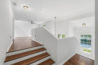 Welcome to this stunning pool home in the guard-gated Hunter's on Hunters Green Country Club in Florida - for sale on GolfHomes.com, golf home, golf lot