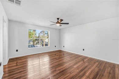 Welcome to this stunning pool home in the guard-gated Hunter's on Hunters Green Country Club in Florida - for sale on GolfHomes.com, golf home, golf lot