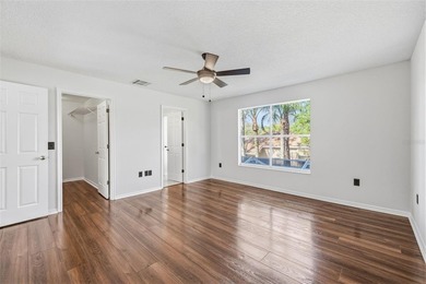 Welcome to this stunning pool home in the guard-gated Hunter's on Hunters Green Country Club in Florida - for sale on GolfHomes.com, golf home, golf lot