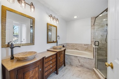 Welcome to this stunning pool home in the guard-gated Hunter's on Hunters Green Country Club in Florida - for sale on GolfHomes.com, golf home, golf lot