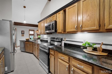 Stop the car! Updated 4 bedroom, 2 bath home tucked away in a on Lake Saint Louis Par 3 in Missouri - for sale on GolfHomes.com, golf home, golf lot