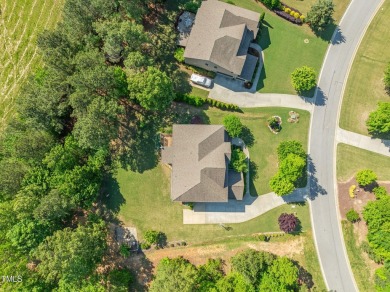 Welcome to 1046 Covered Bridge Trail - a spacious and elegant on The Preserve At Jordan Lake Golf Club in North Carolina - for sale on GolfHomes.com, golf home, golf lot
