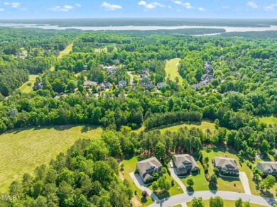 Welcome to 1046 Covered Bridge Trail - a spacious and elegant on The Preserve At Jordan Lake Golf Club in North Carolina - for sale on GolfHomes.com, golf home, golf lot