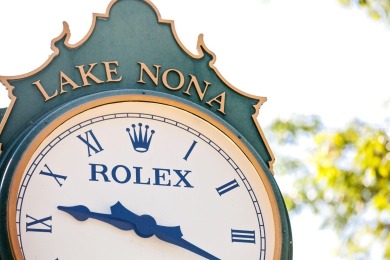 This private, tucked-away residence is perfectly located on the on Lake Nona Golf Club, Inc. in Florida - for sale on GolfHomes.com, golf home, golf lot