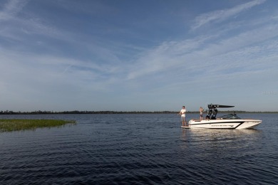 This private, tucked-away residence is perfectly located on the on Lake Nona Golf Club, Inc. in Florida - for sale on GolfHomes.com, golf home, golf lot