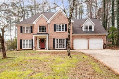 Stunning beauty surrounds this graceful home in Brookstone on Brookstone Golf and Country Club in Georgia - for sale on GolfHomes.com, golf home, golf lot