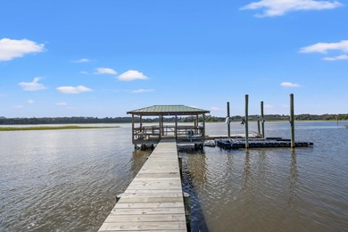 Privately nestled on a serene cul-de-sac within the gated on The Links at Stono Ferry in South Carolina - for sale on GolfHomes.com, golf home, golf lot