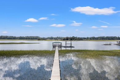 Privately nestled on a serene cul-de-sac within the gated on The Links at Stono Ferry in South Carolina - for sale on GolfHomes.com, golf home, golf lot