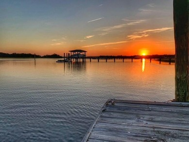 Privately nestled on a serene cul-de-sac within the gated on The Links at Stono Ferry in South Carolina - for sale on GolfHomes.com, golf home, golf lot