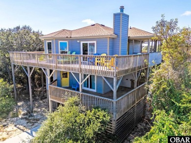 Fall in! Sitting well elevated in an X flood zone, Sunny Days is on The Currituck Golf Club in North Carolina - for sale on GolfHomes.com, golf home, golf lot
