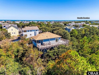 Fall in! Sitting well elevated in an X flood zone, Sunny Days is on The Currituck Golf Club in North Carolina - for sale on GolfHomes.com, golf home, golf lot