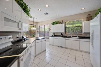 Welcome to this lovely and unique 3-bedroom, 3-bathroom home on Wycliffe Golf and Country Club in Florida - for sale on GolfHomes.com, golf home, golf lot