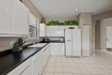 Welcome to this lovely and unique 3-bedroom, 3-bathroom home on Wycliffe Golf and Country Club in Florida - for sale on GolfHomes.com, golf home, golf lot