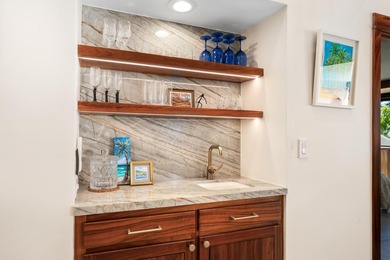 Enjoy sweeping ocean and sunset views from this beautifully on Kona Country Club Golf Course in Hawaii - for sale on GolfHomes.com, golf home, golf lot