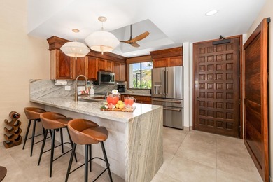 Enjoy sweeping ocean and sunset views from this beautifully on Kona Country Club Golf Course in Hawaii - for sale on GolfHomes.com, golf home, golf lot