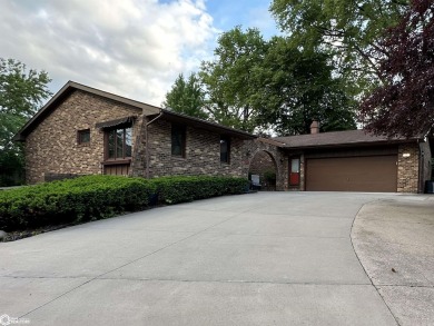 Nestled in a quiet, wooded neighborhood between Sunnyside Park & on Burlington Golf Club in Iowa - for sale on GolfHomes.com, golf home, golf lot