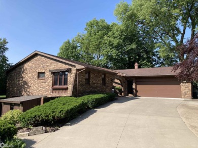 Nestled in a quiet, wooded neighborhood between Sunnyside Park & on Burlington Golf Club in Iowa - for sale on GolfHomes.com, golf home, golf lot