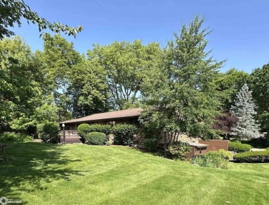 Nestled in a quiet, wooded neighborhood between Sunnyside Park & on Burlington Golf Club in Iowa - for sale on GolfHomes.com, golf home, golf lot