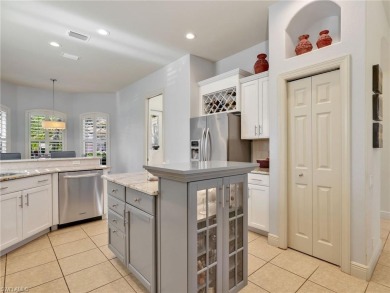 This stunning Pelican Marsh pool home is located in the sought on  in Florida - for sale on GolfHomes.com, golf home, golf lot