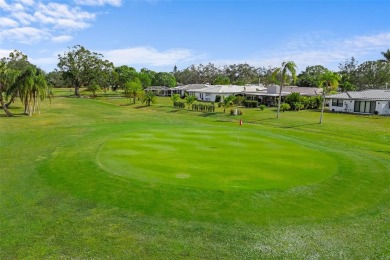 Under contract-accepting backup offers. Charming Golf Course on Village Green Golf Club of Sarasota in Florida - for sale on GolfHomes.com, golf home, golf lot