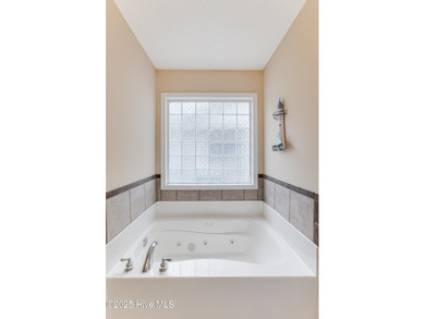 Classic Carolina Shores subdivision split three bedroom floor on Carolina Shores Golf Course in North Carolina - for sale on GolfHomes.com, golf home, golf lot