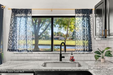 Spectacular lake, golf course, and tree-lined views! A welcoming on Suntree Country Club in Florida - for sale on GolfHomes.com, golf home, golf lot