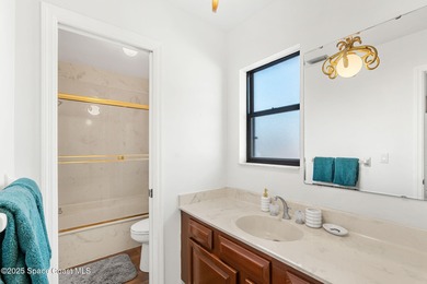 Spectacular lake, golf course, and tree-lined views! A welcoming on Suntree Country Club in Florida - for sale on GolfHomes.com, golf home, golf lot