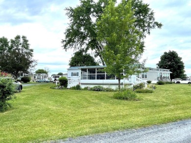 Enjoy summer in Vermont with a cottage at Apple Island Resort on on Apple Island Golf Course At Apple Island Resort in Vermont - for sale on GolfHomes.com, golf home, golf lot