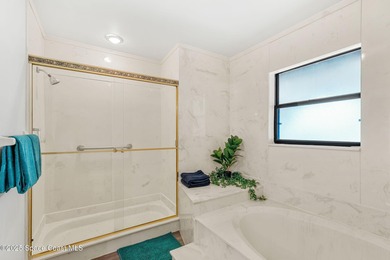 Spectacular lake, golf course, and tree-lined views! A welcoming on Suntree Country Club in Florida - for sale on GolfHomes.com, golf home, golf lot