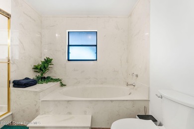 Spectacular lake, golf course, and tree-lined views! A welcoming on Suntree Country Club in Florida - for sale on GolfHomes.com, golf home, golf lot