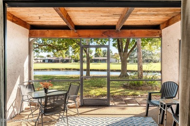 Spectacular lake, golf course, and tree-lined views! A welcoming on Suntree Country Club in Florida - for sale on GolfHomes.com, golf home, golf lot