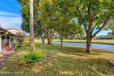 Spectacular lake, golf course, and tree-lined views! A welcoming on Suntree Country Club in Florida - for sale on GolfHomes.com, golf home, golf lot