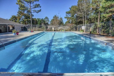 Welcome to low-maintenance living with thoughtful updates and on Inland Greens Golf Course in North Carolina - for sale on GolfHomes.com, golf home, golf lot