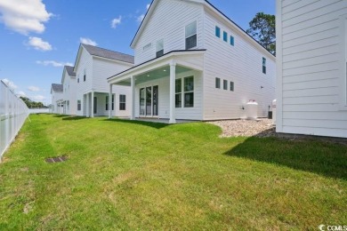 Fall in love with this 4-bedroom, 2.5-bath home in the desirable on Tidewater Golf Club and Plantation in South Carolina - for sale on GolfHomes.com, golf home, golf lot