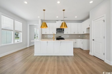 Fall in love with this 4-bedroom, 2.5-bath home in the desirable on Tidewater Golf Club and Plantation in South Carolina - for sale on GolfHomes.com, golf home, golf lot