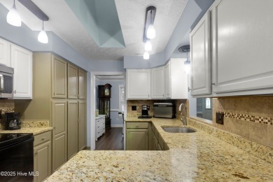 Charming waterview retreat! Welcome to 901 Caracara Drive a on Harbour Point Golf Club in North Carolina - for sale on GolfHomes.com, golf home, golf lot