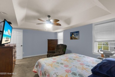 Charming waterview retreat! Welcome to 901 Caracara Drive a on Harbour Point Golf Club in North Carolina - for sale on GolfHomes.com, golf home, golf lot