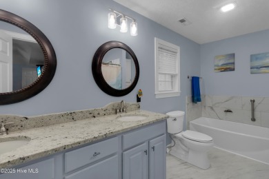 Charming waterview retreat! Welcome to 901 Caracara Drive a on Harbour Point Golf Club in North Carolina - for sale on GolfHomes.com, golf home, golf lot